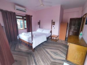 Maria Paulo Guest House Bar and Restaurant客房内的一张或多张床位