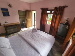 Maria Paulo Guest House Bar and Restaurant客房内的一张或多张床位