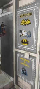 a sign for a superhero show with a batmobile at Batman Airport Catania City in Catania