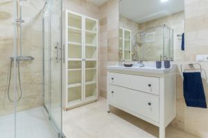 a bathroom with a sink and a shower at Apartamentos Castillo by Sur Suites in Fuengirola +121 photos