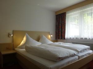 מיטה או מיטות בחדר ב-Appartement Klotz