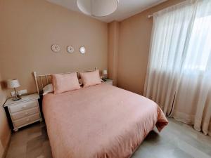 Posteľ alebo postele v izbe v ubytovaní Novo Sancti Petri - Playa, Piscina, Golf y Relax