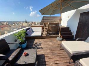 A balcony or terrace at Andreea’s Cosy Jacuzzy Town House