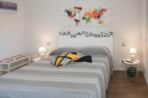 Postel nebo postele na pokoji v ubytování Le terrazze di casa Bonelli