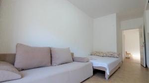 a living room with a couch and a table at MM Apartments in Budva