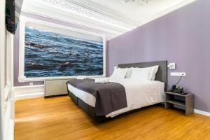 Cama ou camas em um quarto em Flag Design Hotel