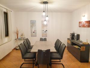 a dining room with a table and chairs at Holiday home Elis in Fažana