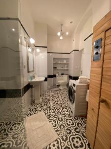 a bathroom with a shower and a sink and a toilet at Apartmány u sv. Michaela in Kadaň