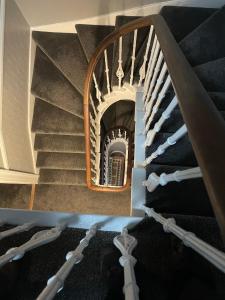
a staircase leading up to a stair case at Shandwick House in Tain

