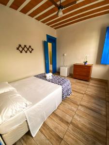 Giường trong phòng chung tại Pousada Doce Villa