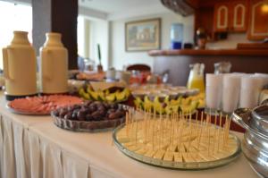 a buffet of food and drinks on a table at Takana Inn in Tacna