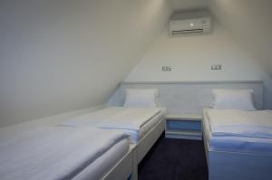Rúm í herbergi á Villa Kiwi