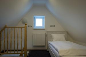 Rúm í herbergi á Villa Kiwi