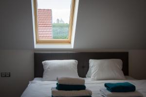 Rúm í herbergi á Villa Kiwi
