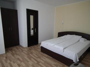 Postel nebo postele na pokoji v ubytování Vila DG