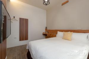 Ένα ή περισσότερα κρεβάτια σε δωμάτιο στο SunShine B&B