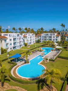 an aerial view of a resort with two pools and palm trees at Caribbean Treasure in Punta Cana