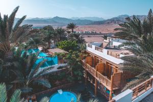 an aerial view of a resort with palm trees at The Bridge Dahab in Dahab