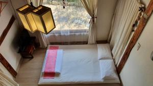 Postel nebo postele na pokoji v ubytování Greem Guesthouse