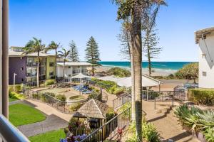 a view of the beach from a balcony of a resort at Coolum Beachside Apartments in Coolum Beach