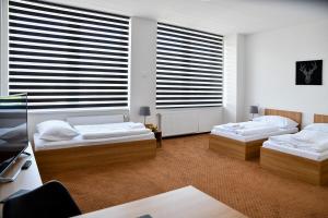 Llit o llits en una habitació de Hotel Fabrika