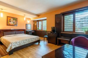 A bed or beds in a room at Hotel Ego - Free Parking - Top Central Location
