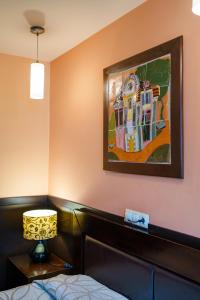 A bed or beds in a room at Hotel Ego - Free Parking - Top Central Location