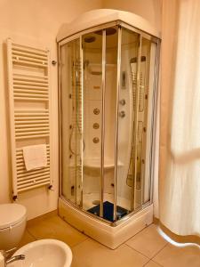 a bathroom with a shower and a toilet at Residence Del Lago in Desenzano del Garda