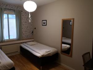 Postel nebo postele na pokoji v ubytování Uppsala Hostel by CityStay