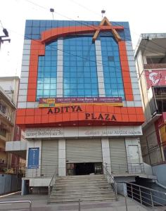 a building with a sign on the front of it at Aditya Inn in Guwahati