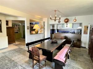 a dining room with a table and some chairs at Cape Sunset Villa in Makrotándalon