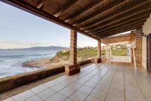 a house with a view of the ocean at Casa Elena in Tresnuraghes