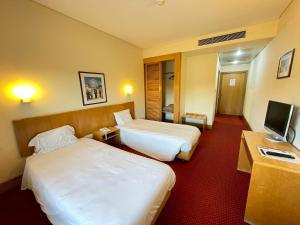 Кровать или кровати в номере Flag Hotel Porto Maia