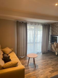 a living room with a couch and a table at Vllla Reva in Argelès-sur-Mer