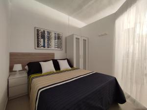 Ліжко або ліжка в номері Apartamento Royal Gines II a 10" de Sevilla, a 20" del Aeropuerto de Sevilla