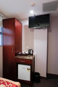 Kuchyň nebo kuchyňský kout v ubytování Megaboom City Hotel
