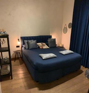 Postel nebo postele na pokoji v ubytování B&B Augusto