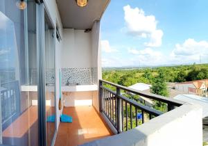 a balcony with a sink and a view at Room 9 Residence in Pluak Daeng