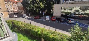 a view of a street with cars parked on the road at Comfortable Studio Old Town/New City in Warsaw +9 photos