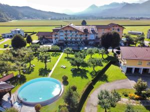 an aerial view of a resort with a swimming pool at Hotel Pachernighof in Velden am Wörthersee