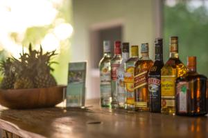 a group of bottles of alcohol sitting on a table at Komodo Garden in Nusa Lembongan