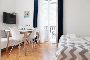 Postel nebo postele na pokoji v ubytování Milla Rooms