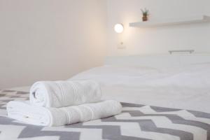 Postel nebo postele na pokoji v ubytování Milla Rooms