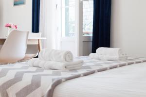 Postel nebo postele na pokoji v ubytování Milla Rooms