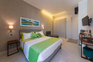 Postel nebo postele na pokoji v ubytování B&B La Piazzetta