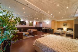 A bed or beds in a room at Hotel Ego - Free Parking - Top Central Location