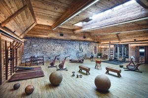 a large room with a gym with exercise equipment at Hotel Klosterbräu in Seefeld in Tirol