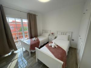 Ένα ή περισσότερα κρεβάτια σε δωμάτιο στο Apartamento Gustamar 11 +36 φωτογραφίες