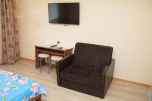 A television and/or entertainment center at Studio Apartments on Krasnoarmeiskaya 54