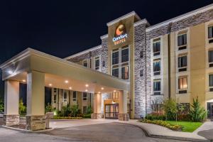 a rendering of a hotel at night at Comfort Suites Columbus Airport in Columbus